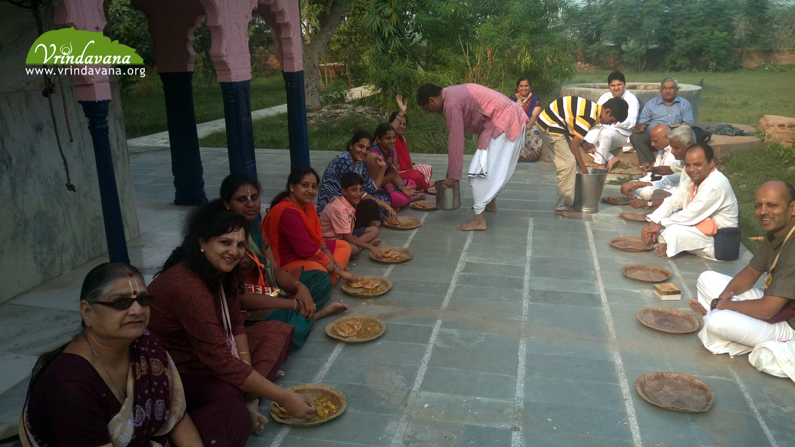 Honoring prasadam at Barsana